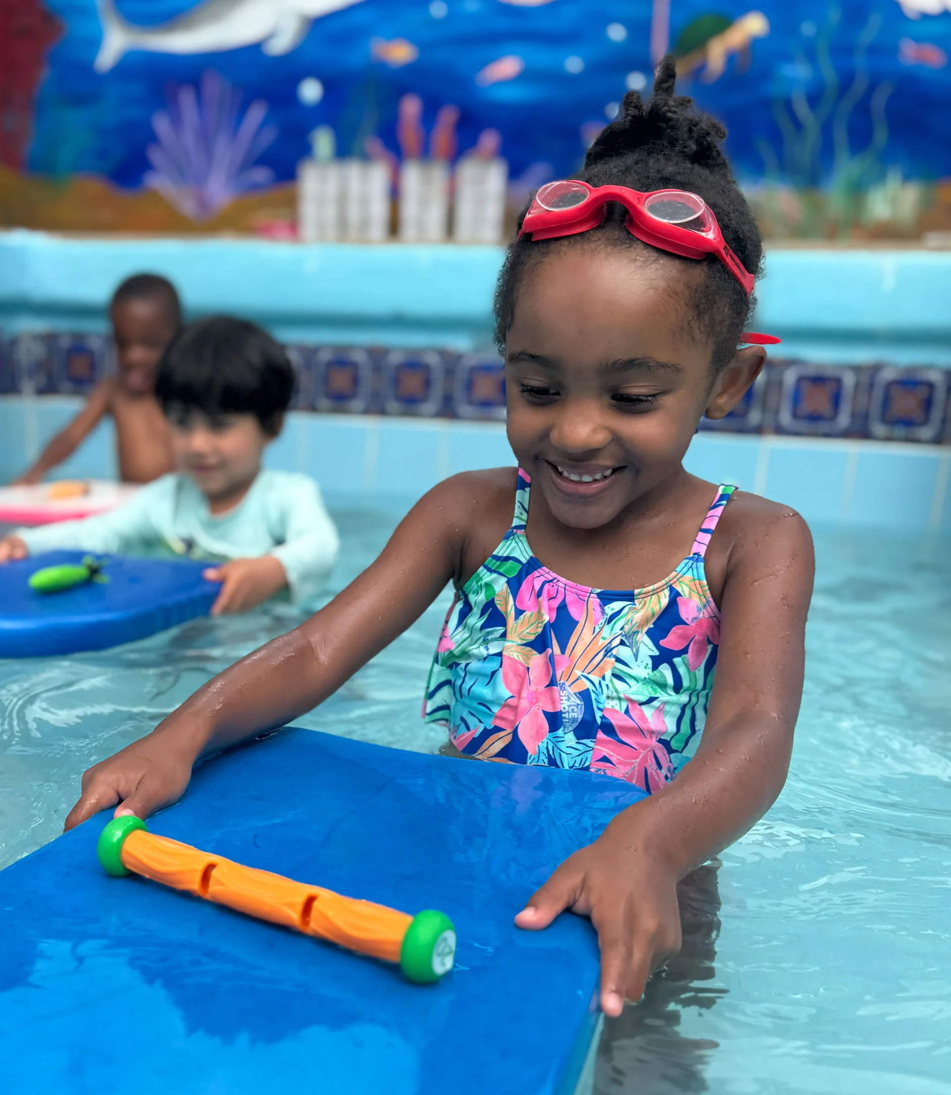 girl learning how to swim at camp